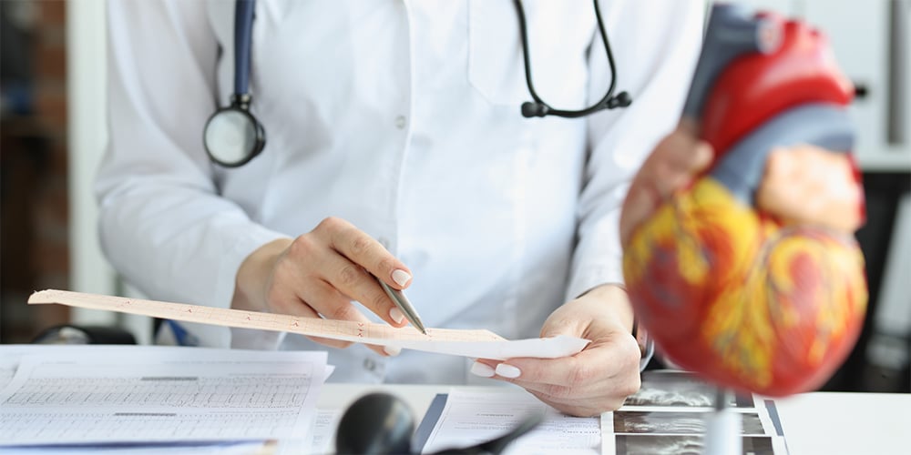 A cardiologist examining medical documents